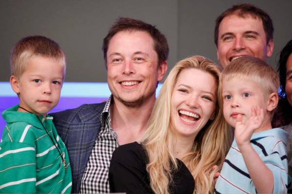 Elon Musk, CEO of Tesla Motors, stands with his ex-wife Talulah Riley and his twin sons Griffin, left, and Xavier, right on June, 29, 2010.