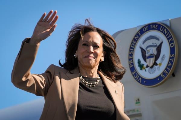 Vice President Kamala Harris waving while boarding Air Force Two at Philadelphia Internatio<em></em>nal Airport, en route to Atlanta in October 2024