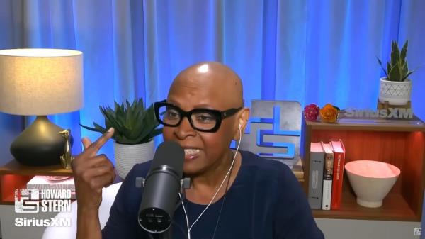 Robin Quivers bald talking. 