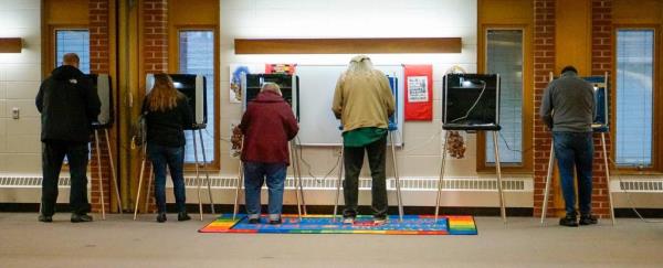 Voters nearly fill all the booths at the First United Lutheran church poll, Tuesday, April 2, 2024, in Sheboygan, Wis.