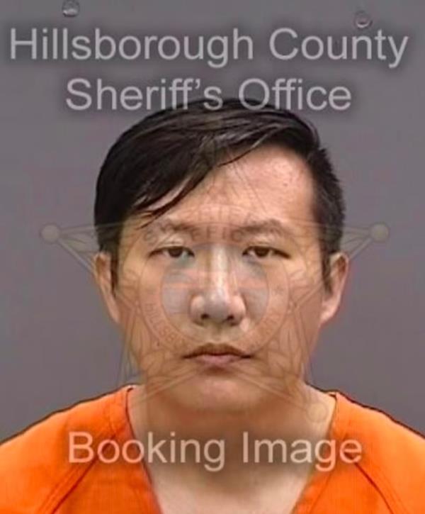 Li is pictured in a mugshot.