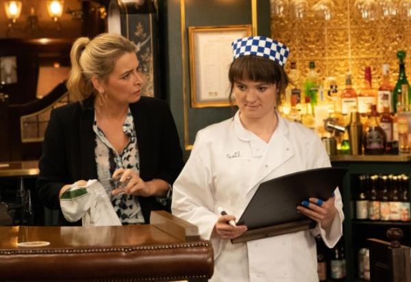 Charity watches Gail in the pub as she starts a job as a chef in Emmerdale