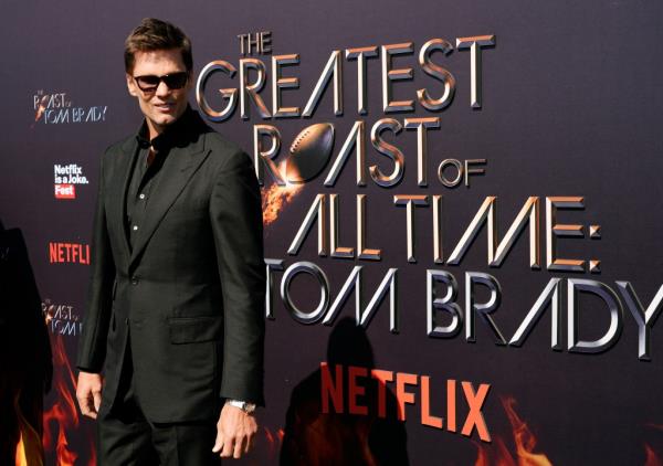 Tom Brady poses on the red carpet at The Greatest Roast of All Time: Tom Brady