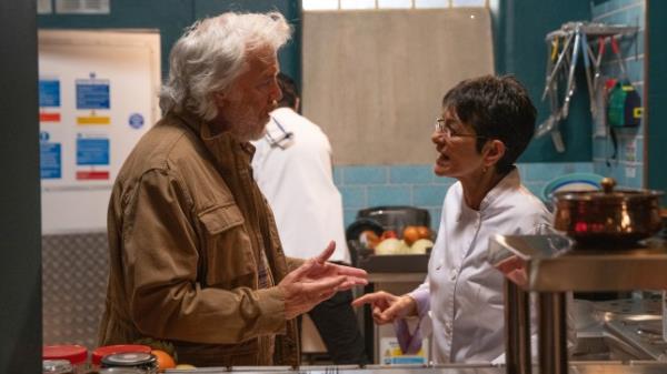 Yasmeen speaks to Stu in the kitchen at Speed Daal in Corrie