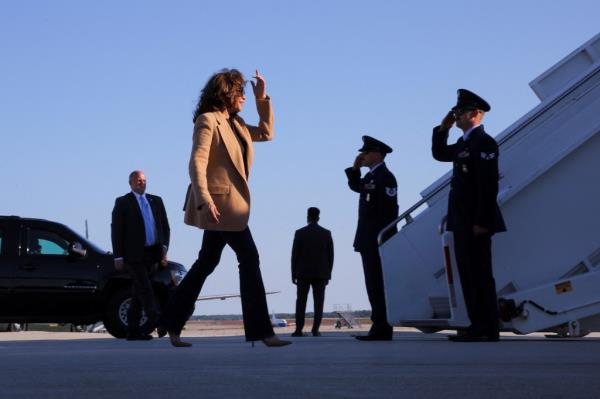 Harris walks to board Air Force Two for departure from Portsmouth, New Hampshire.