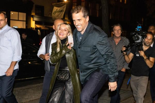 Hunter Biden with his wife Melissa Cohen on the opening night of his art exhibition at Georges Berges Gallery in Soho. on Nov. 10, 2021. Morris (behind Biden) has helped the president’s son market his paintings.