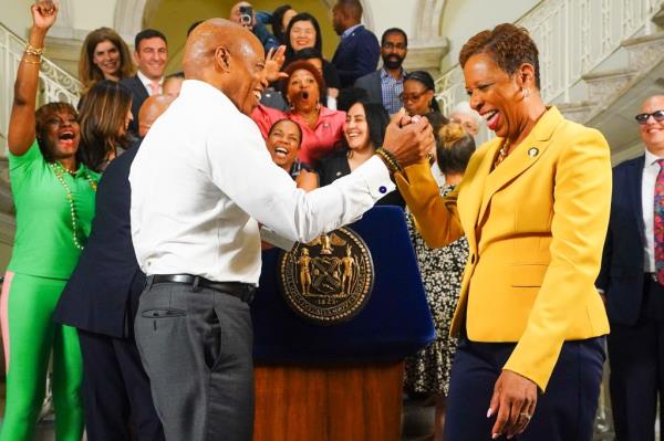 Mayor Eric Adams and City Council Speaker Adrienne Adams as they celebrate a handshake agreement on the 2025 budget.