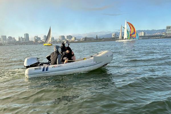 Suspected pirates use a small boat to board large ships and yachts in Oakland Harbor.