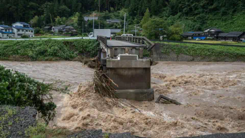 Getty Images A collapsed bridge is seen following heavy rain in Wajima city, Ishikawa prefecture on September 22, 2024