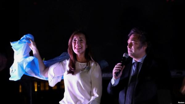 Argentine President-elect Javier Milei and Vice President-elect Victoria Villarruel greet supporters after winning Argentina's runoff presidential election, in Buenos Aires, Argentina, Nov. 19, 2023. 