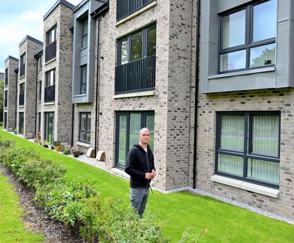 Jamie Walker, 47, moved into a 12-flat apartment block in West Dunbarto<em></em>nshire in February last year