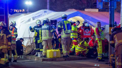 Getty Images Firefighters and emergency respo<em></em>nders set up triage units near the Christmas market in Magdeburg