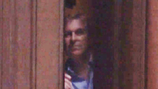 Prince Andrew peering out from behind the door of co<em></em>nvicted sex offender Jeffrey Epstein’s Manhattan mansion in 2010 in a video published by the Mail on Sunday in 2019.